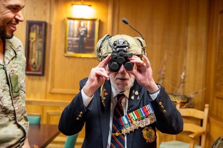 One-hundred-year-old veteran John Eskdale inspires the next generation of Royal Marines during a visit to the Commando Training Centre in Lympstone, Devon. Release date February 21 2025. A 100-year-old World War Two commando inspired the next generation of Royal Marines during a visit to the Commando Training Centre in Lympstone, Devon. John Eskdale from Lydney in Gloucestershire saw combat with HMS Charybdis in the Mediterranean on the Malta Convoys in 1942 and was involved in the invasion of Sicily in the summer of 1943. He survived the sinking of Charybdis by German Torpedo boats near the Channel Islands in late 1943 and went onto see action in Normandy and in the Far East.