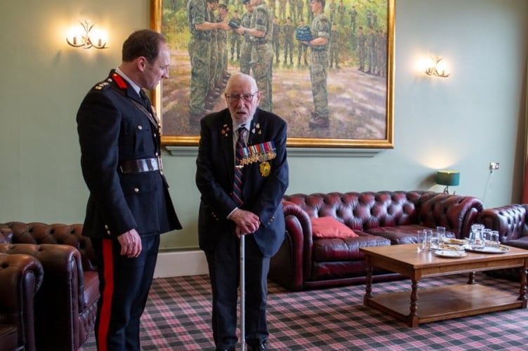 One-hundred-year-old veteran John Eskdale inspires the next generation of Royal Marines during a visit to the Commando Training Centre in Lympstone, Devon. Release date February 21 2025. A 100-year-old World War Two commando inspired the next generation of Royal Marines during a visit to the Commando Training Centre in Lympstone, Devon. John Eskdale from Lydney in Gloucestershire saw combat with HMS Charybdis in the Mediterranean on the Malta Convoys in 1942 and was involved in the invasion of Sicily in the summer of 1943. He survived the sinking of Charybdis by German Torpedo boats near the Channel Islands in late 1943 and went onto see action in Normandy and in the Far East.