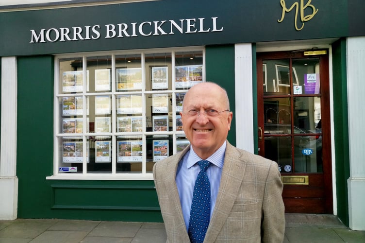 Norman Bricknell outside his estate agent office in Ross.