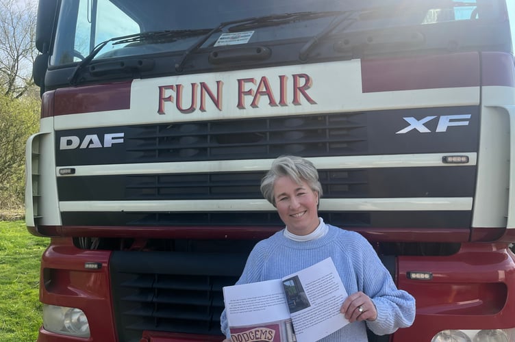 Claire Carey with one of the books written 