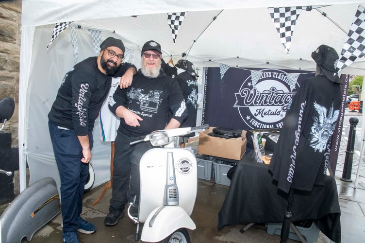 Surj Pal and Adrian Cowlard of Vintage Metals in Coleford with a Vespa.
