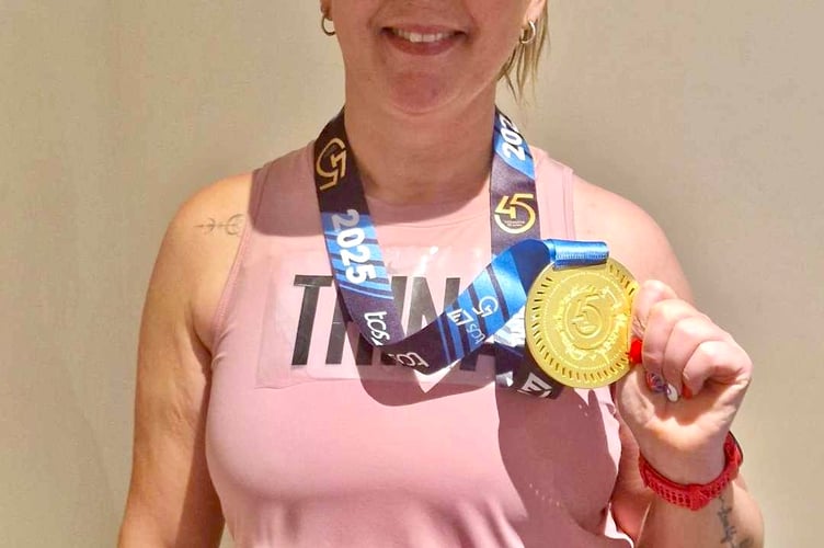 Trina Sami-Brown proudly shows her London Marathon medal