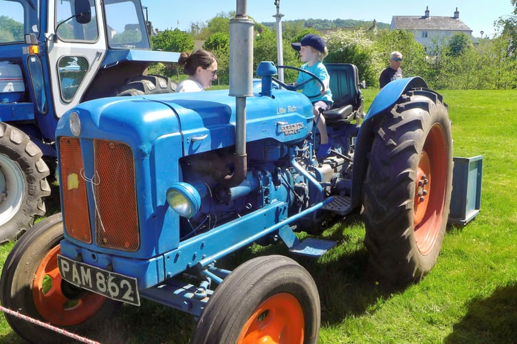 Mum Mel and Celyn from Monmouth enjoy a sit on a Fordson Major owned by Mr Goulding from Kilcot near Newent