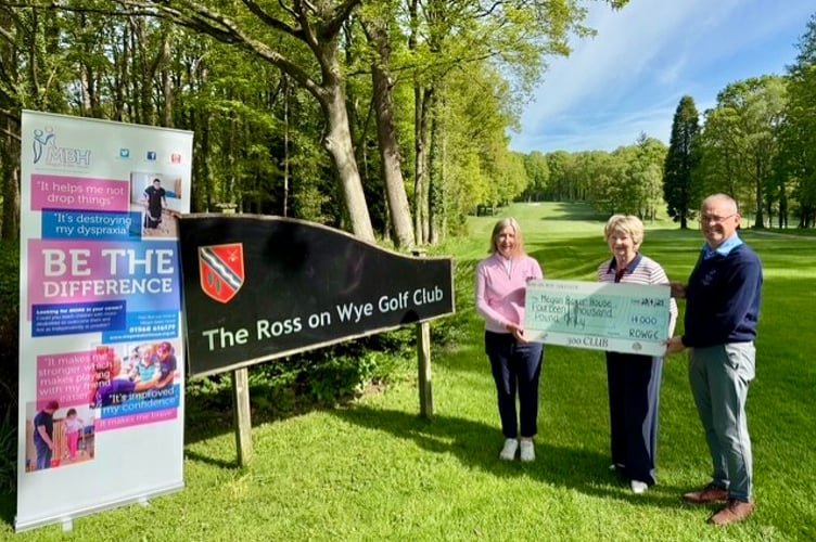 (From left) Lorraine Fenner, Lee Gough (Megan Baker House) and Mark Whitmore with the cheque for £14,000 at Ross Golf Club