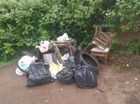 Black bags, furniture, a tyre and bike parts dumped near donation bin