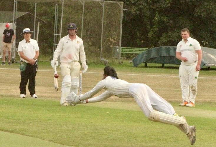 Dharzekanth Yoganadan makes an athletic leap to take a catch for Aston Ingham in the National Village Cup clash. Photo: Finbarr Carrol, Loddington & Mawsley Cricket Club