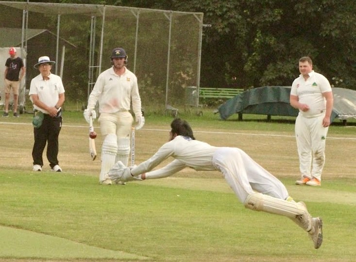 Dharzekanth Yoganadan makes an athletic leap to take a catch for Aston Ingham in the National Village Cup clash. Photo: Finbarr Carrol, Loddington & Mawsley Cricket Club