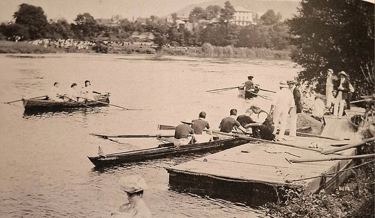 Boats launch out at Ross in an early regatta