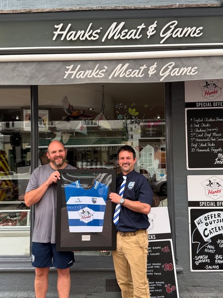 Local butcher and Ross RFC juniors sponsor Tim Hanks is presented with his own framed  match jersey