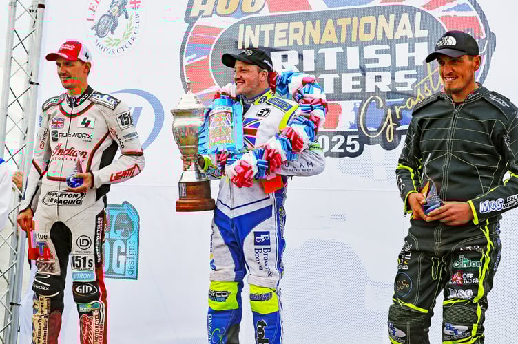 The top three 500cc solo riders celebrate on the podium