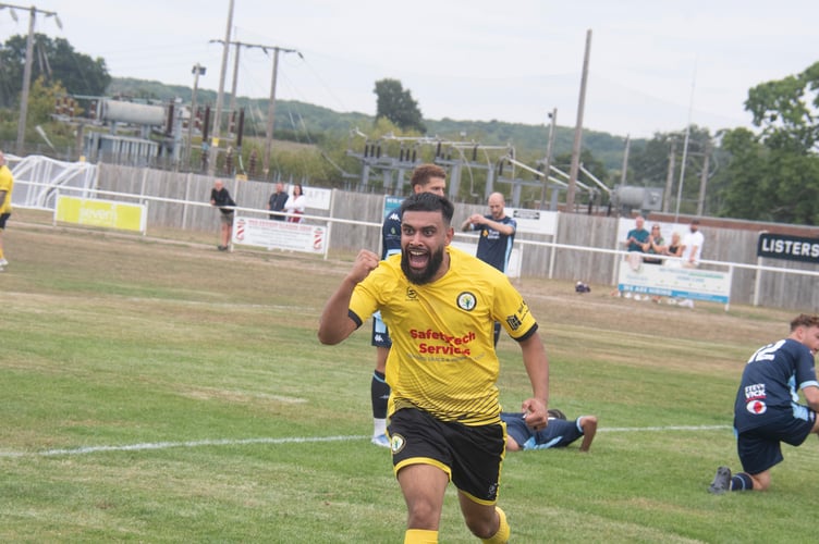 Man of the Match Jaber Ahmed celebrates his goal which sealed Newent Town's FA Vase win.