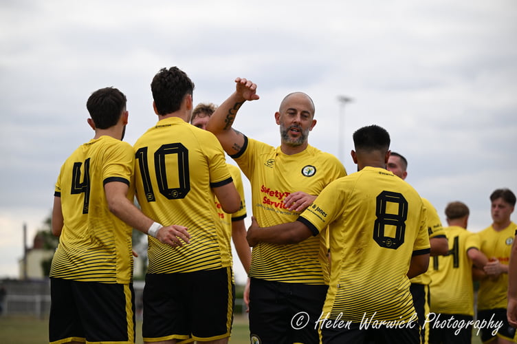 Newent players celebrate a goal