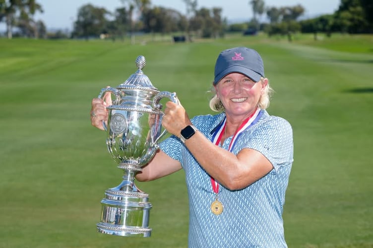 Becky Morgan proudly lifts the US Senior Women’s Open trophy