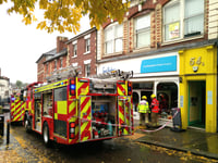 Firefighters quickly control charity shop's electrical fault