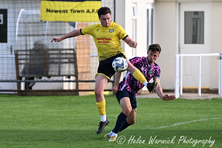 A Daffs player wins the battle for the ball