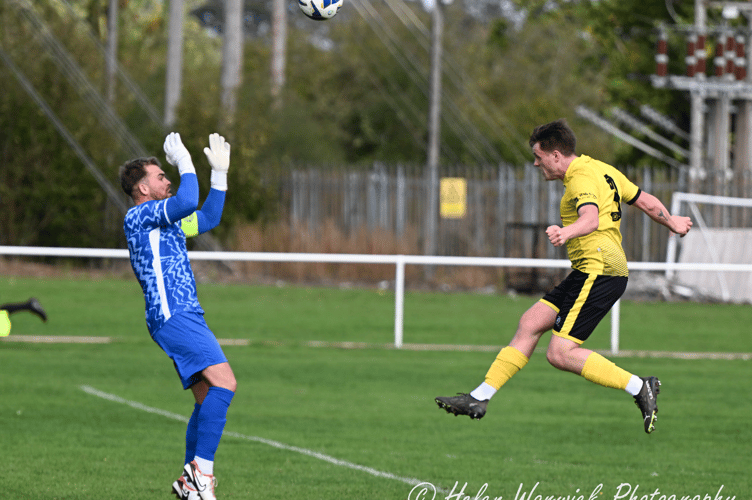 George Brand heads in over the keeper