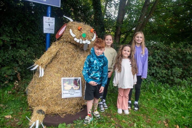 Noah Smith with Marnie Matthews and Olivia and Mabel Moseley with Hopebrook School's Guffalo.