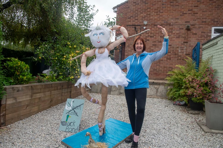 Heather Swift, who is part of Silver Swans adult ballet class in Broadwell with a Swan Lake scarecrow created with Mary Croudace, Annette Smith and Cheryl Ridley.