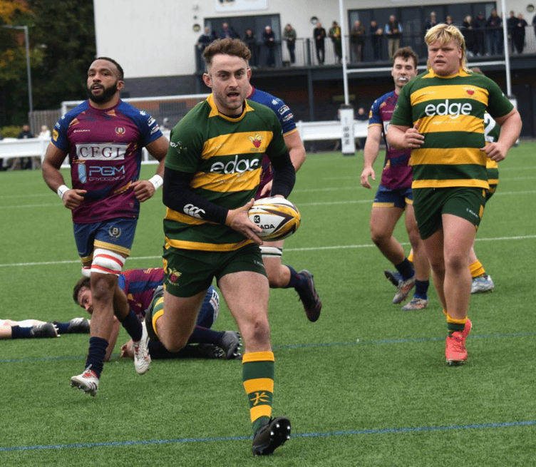 Nathan Brooks breaks through for Newent's first try. Picture: Georgina Gardner.