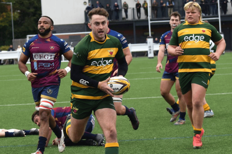 Nathan Brooks breaks through for Newent's first try. Picture: Georgina Gardner.