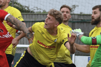 Newent stand firm at the back as they battle to contain league leaders FC Stratford.