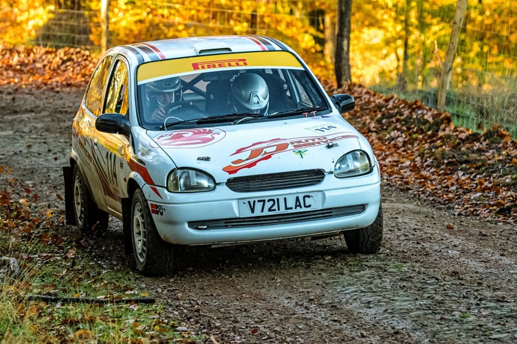 David Troughton and Amy McDougall race through the Forest in their Vauxhall Corsa