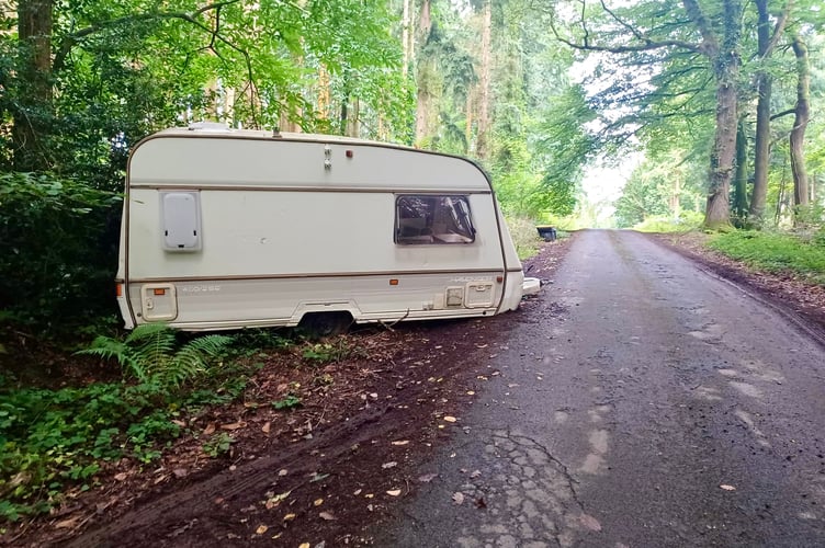 The dilapidated caravan was found dumped on a woodland lane near Ross