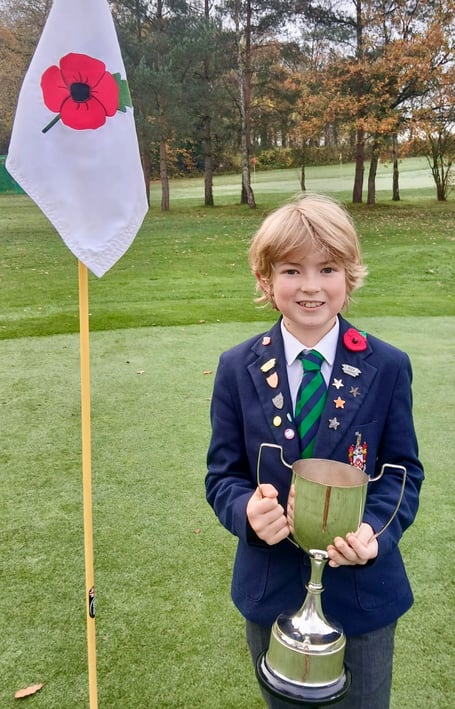 George Swann proudly holds the cup