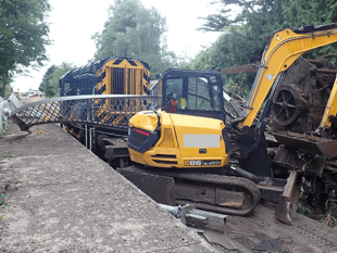 Digger on train which pulled down 133-year-old bridge loaded wrongly 