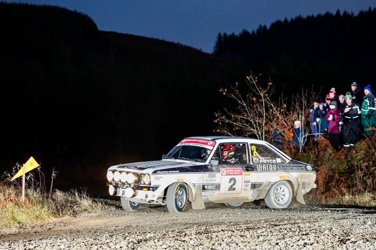 Osian Pryce and Dale Furniss race into the night on their way to RAC Rally victory
