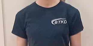 Teen Katie kicks on with black belt second dan