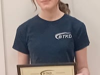Teen Katie kicks on with black belt second dan