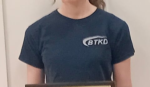 Teen Katie kicks on with black belt second dan