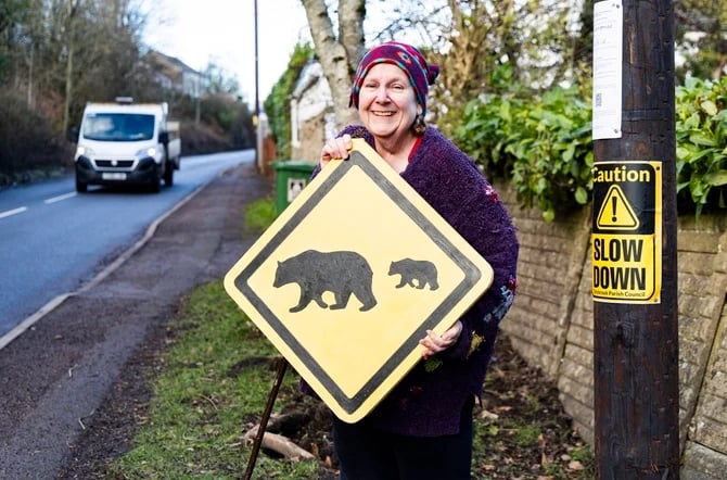 Penny Ballinger with her bear sign.