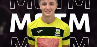 Ten-man Hill hang on to climb out of dropzone 