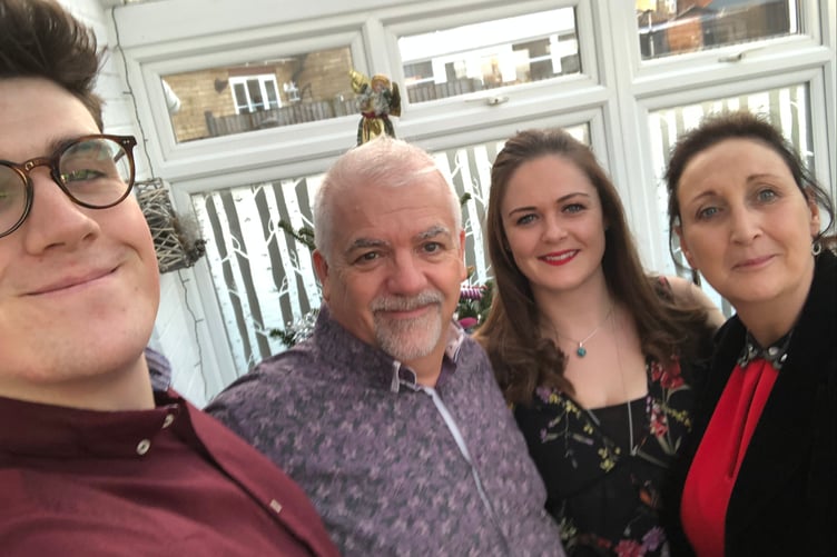 Karen Pooley pictured with her husband Andy and their family. The 64-year-old from Lydney died after falling seriously ill while on holiday in Cape Verde.