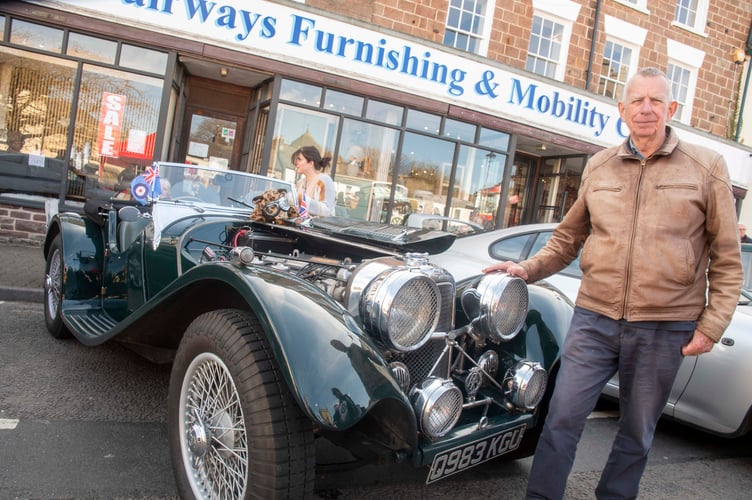 Tim Wells with a replica of a Swallow Sidecars 100, a forerunner of Jaguar.
