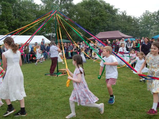 Llangrove villagers celebrate May Day with traditional maypole dance