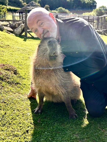 Bill Bailey meets a capybara at Wildlife Exotic Rescue