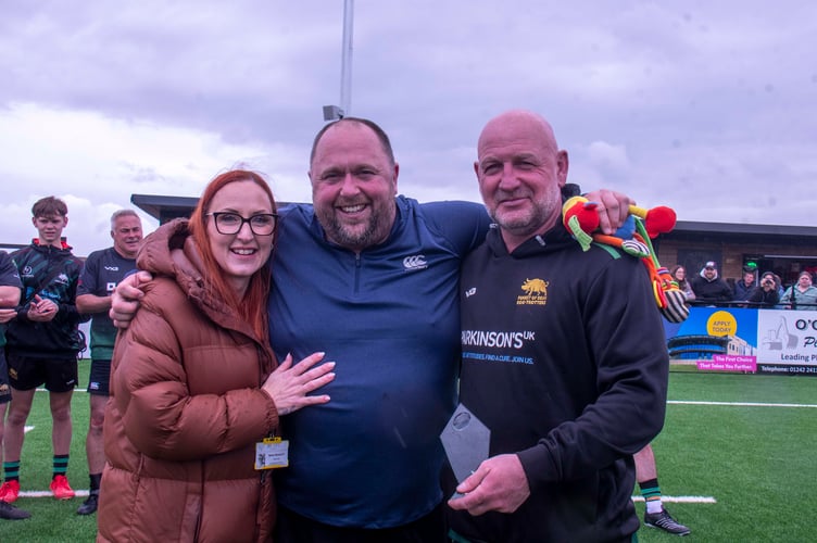 Stan Hardy (right) receives the man-of-the-match award from Nikki Baggott and Chris Allen.