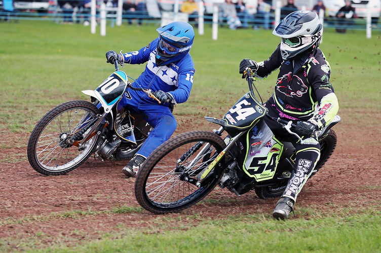 GT140s winner Ian Clark (54) battling with rival Tony Atkin
