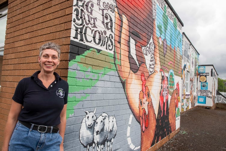 Deb Cook of FVAF with the mural