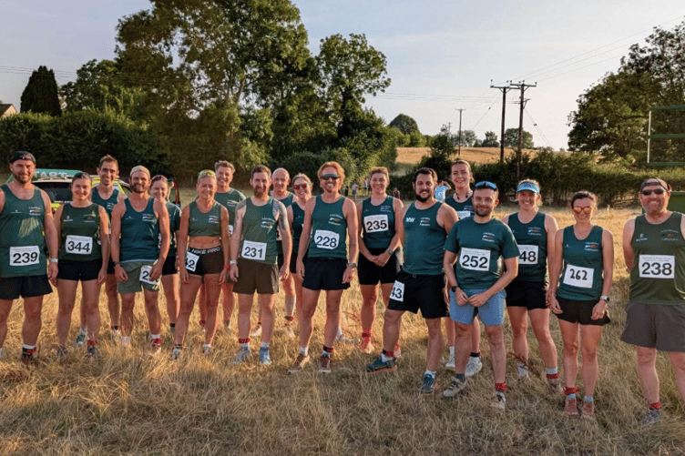 MonRoss Trailblazers members celebrate after finishing third overall in the Herefordshire and Borders Summer Cross Country League following the final race at Newton Court.
