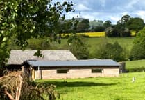 Dairyman's self-built home on farm deemed lawful by council
