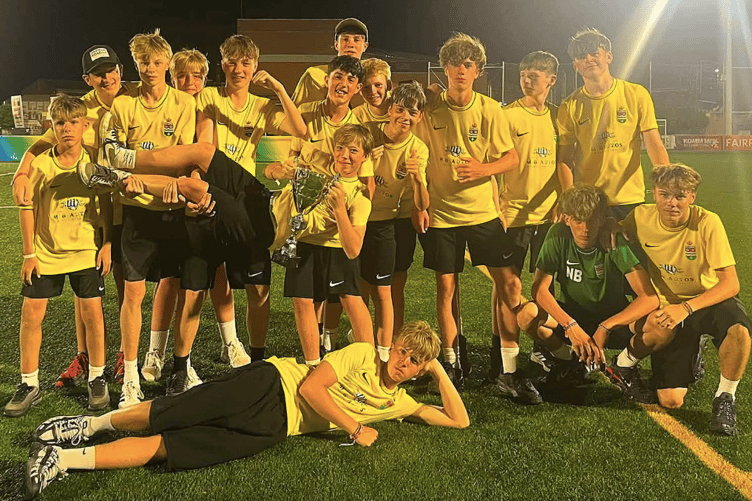 Ross Juniors Under-14s with the Spirit of Football trophy they won during their football tour to Spain.