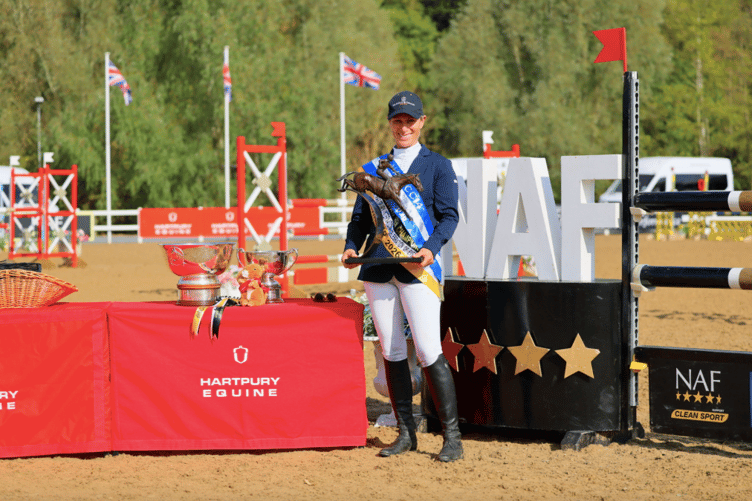 Zara Tindall celebrates with the British Open Championship trophy after riding Class Affair to victory at Hartpury.