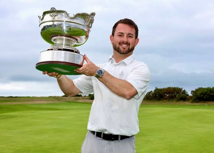 Zach Galliford holds the Welsh PGA cup aloft after regaining the title first won two years ago