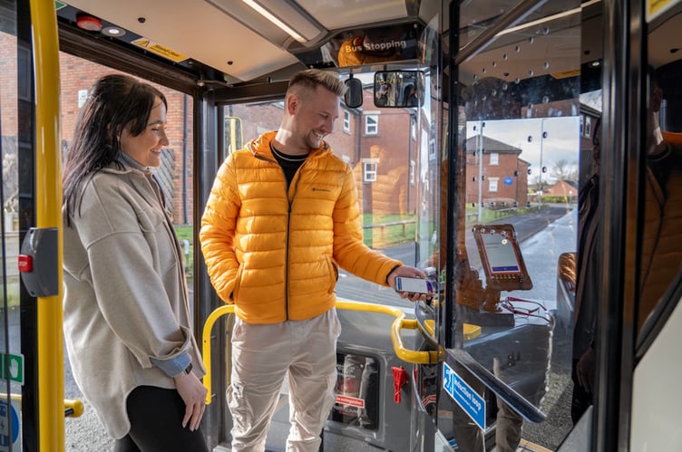 Passengers paying their fare on the 232 Daffodil Line service.