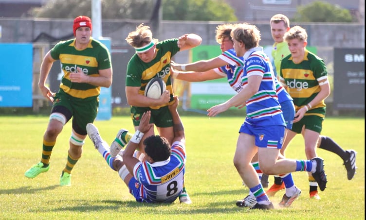 A Newent player on the charge at Weston