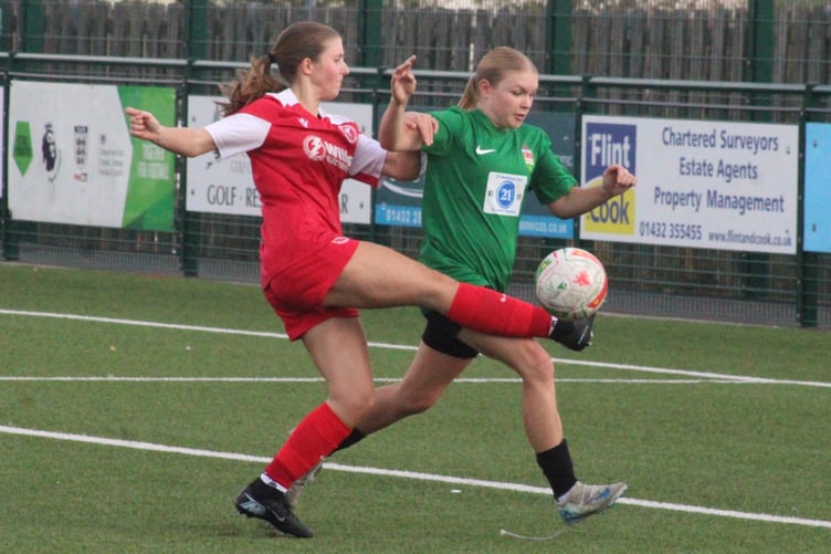 Players battle for the ball in the Pegasus v Ross Juniors game